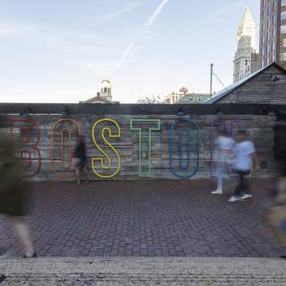 Boston sign over a wall outside City Hall Plaza