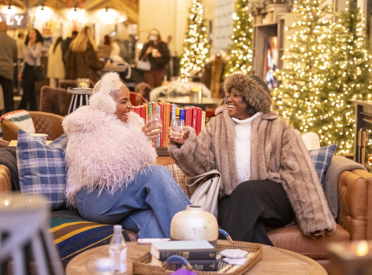 Two people enjoying the Frostival Lodge