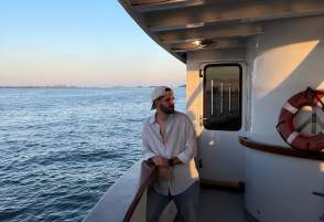 Person on boat in the Boston Harbor