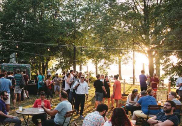 A Crowd At Owl's Nest Beer Garden In Boston, MA