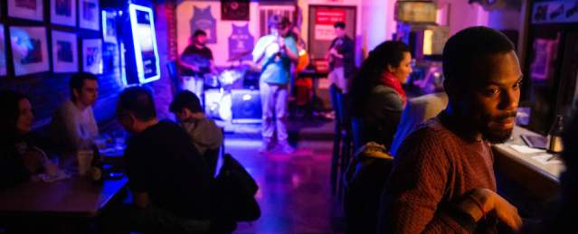 People enjoying live music at wally's cafe Jazz club.